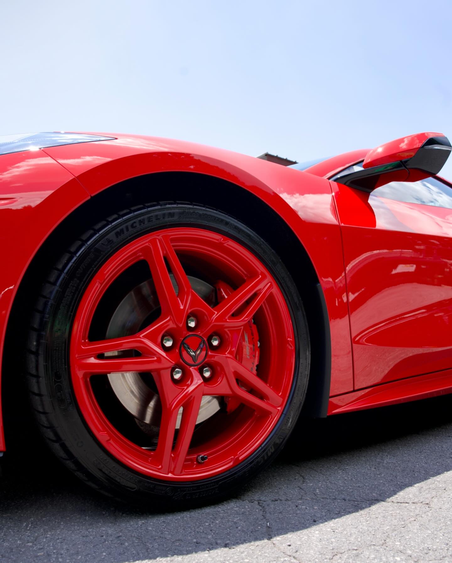 Red C8 Corvette with red painted wheels